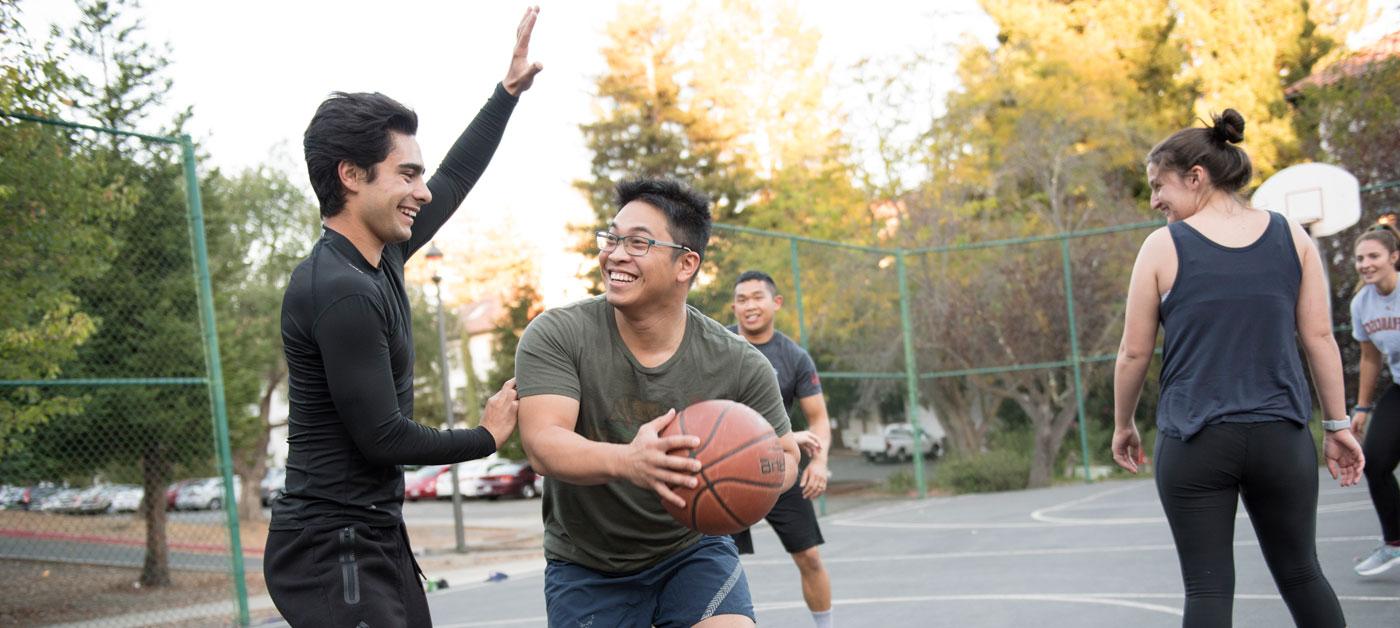 Transfer Students playing basketball